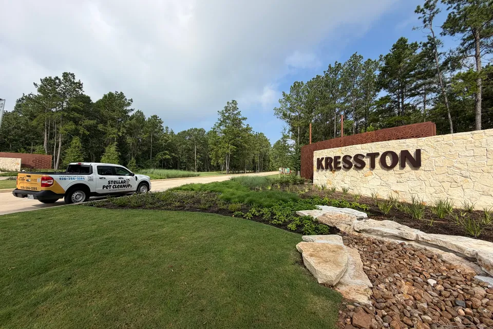 Stellar Pet Cleanup truck parked at the Kresston community entrance in Montgomery, Texas